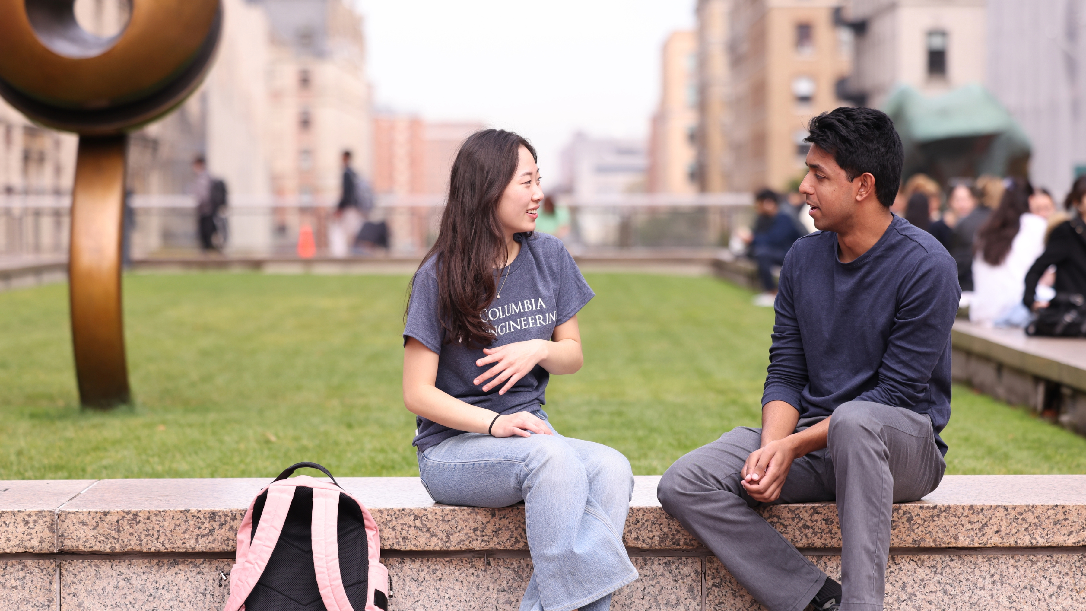 A Columbia Engineering student speaks with ESA staff outside on the lawn.