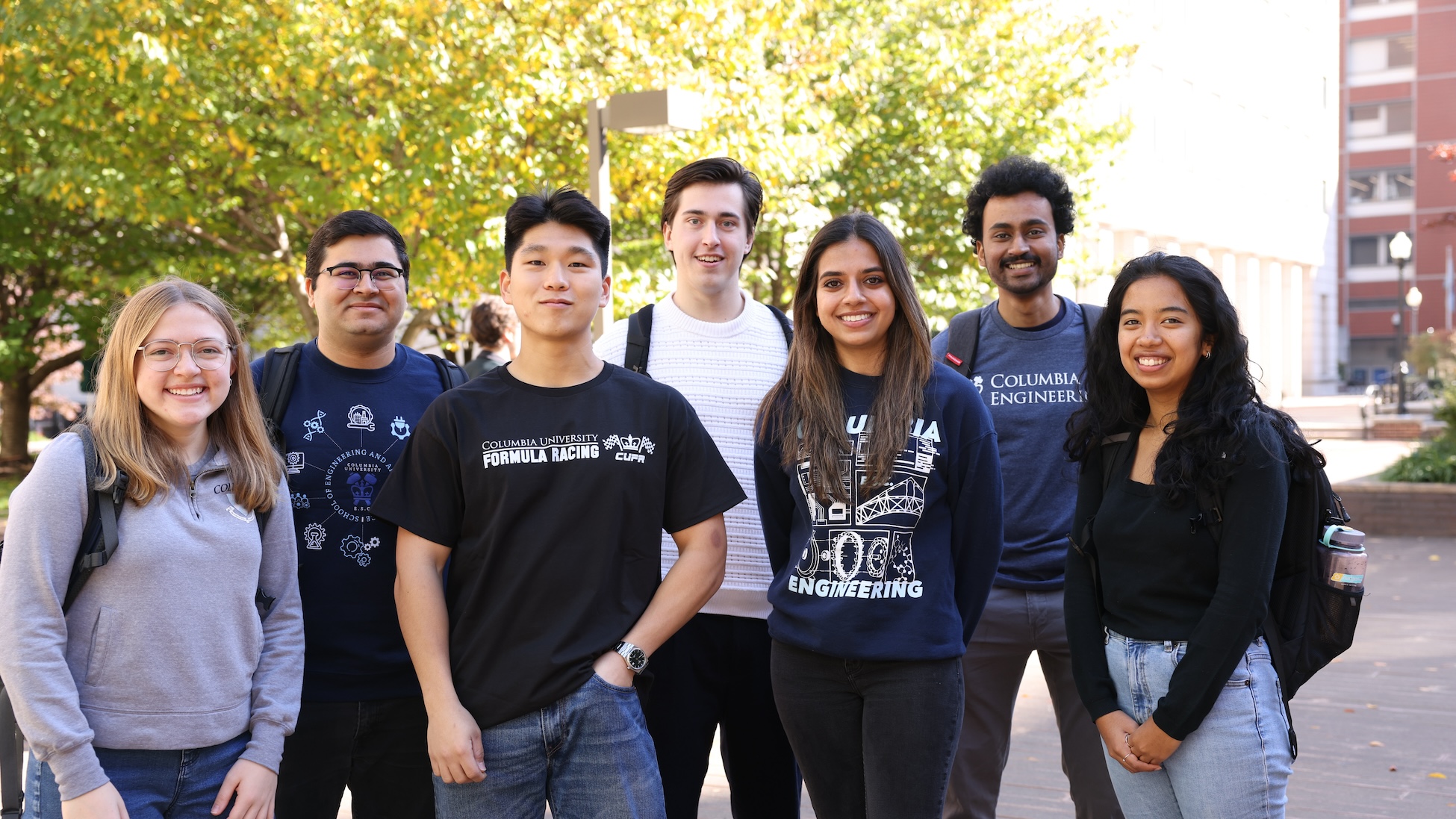 Seven students posing for a photo on Columbia University campus