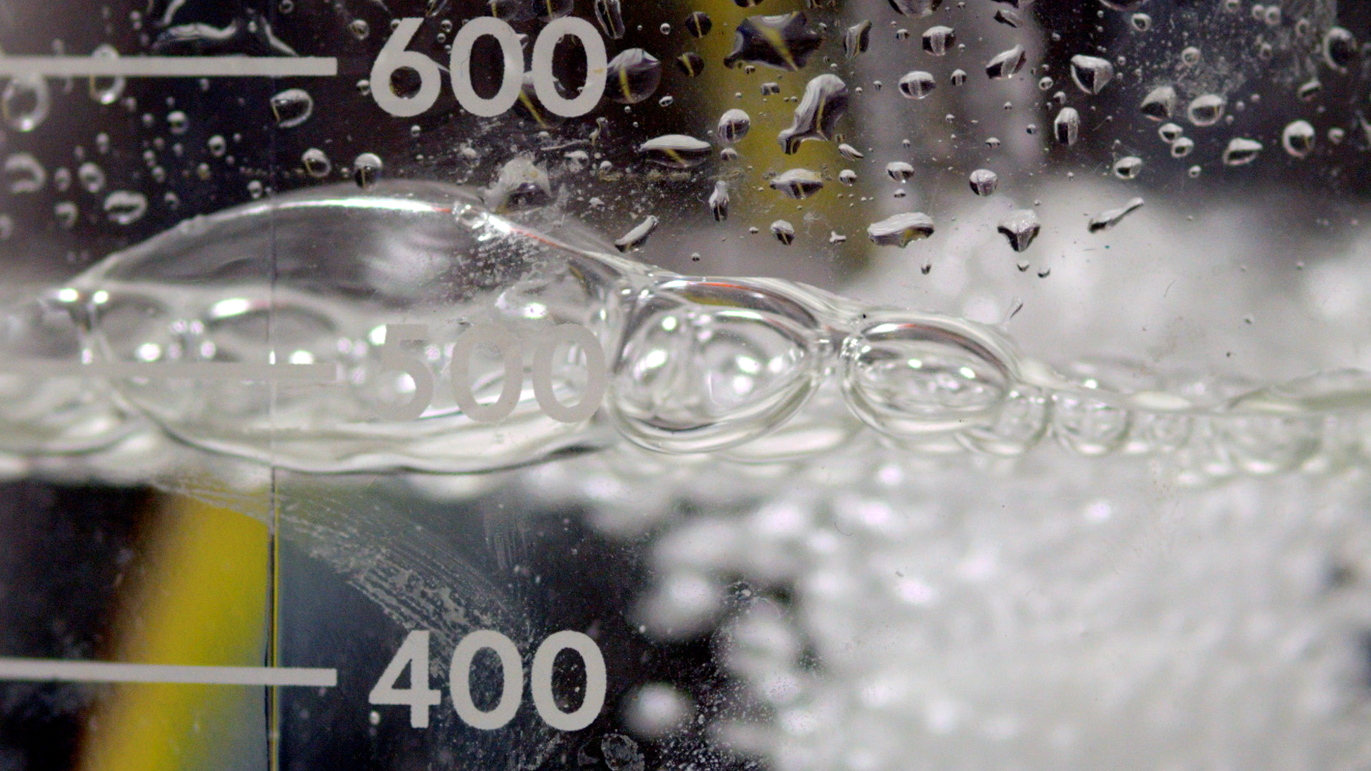 Liquid bubbling in a container with volume indicators