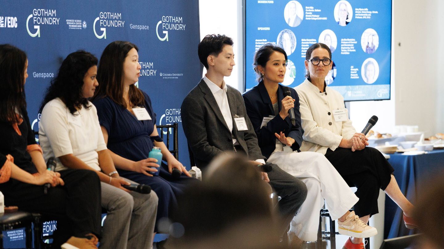 Shiho Kawashima speaking into a microphone while seated beside Diandian Zhao during a panel discussion at the Gotham Foundry symposium.