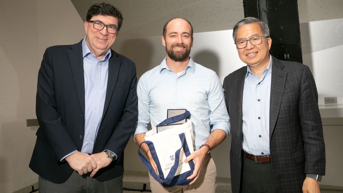 George Deodatis, Daniel Esposito, and Dean Shih-Fu Chang pose together, as Esposito holds a Columbia Engineering tote bag.