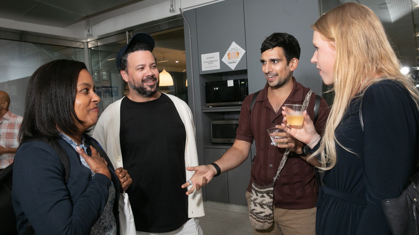 Biomedical Engineering faculty talk with one another at the Welcome Back Faculty and Honors event.