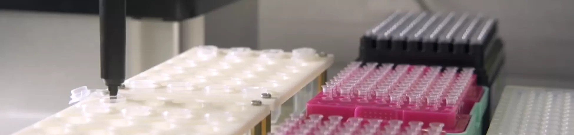 image of multiple test tubes being filled one at a time