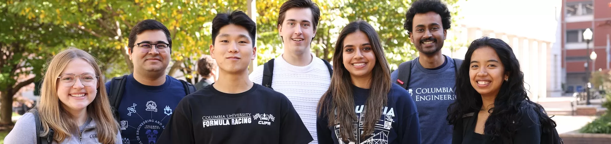 Seven students posing for a photo on Columbia University campus